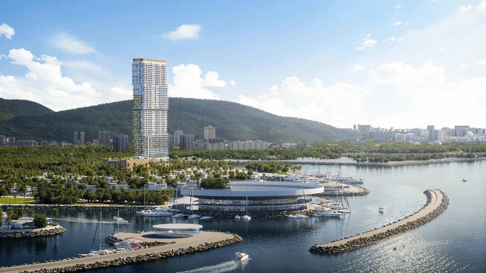 A tower on the island, seen from the sea, with the marina in front and the mountains behind.